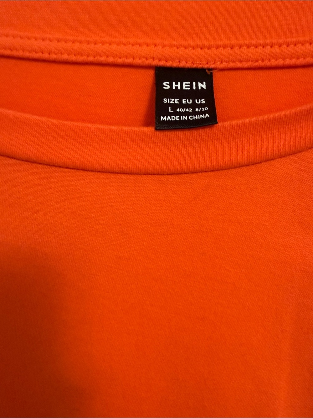 O
Orange Tee with Button Detail